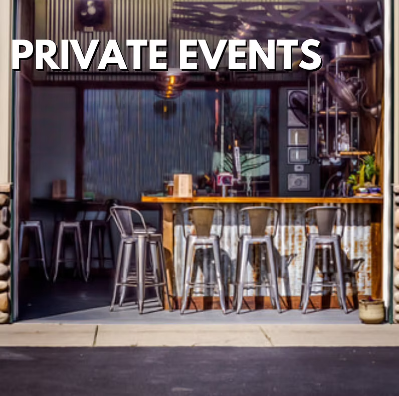 Interior view of a bar or cafe with high chairs at the counter, behind which various kitchen utensils and equipment are visible, with large windows and the words "PRIVATE EVENTS" in bold white letters at the top.