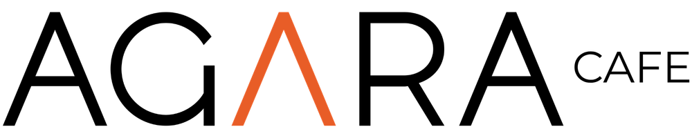 Close-up of a caution sign with a black and yellow striped roller coaster in the background.