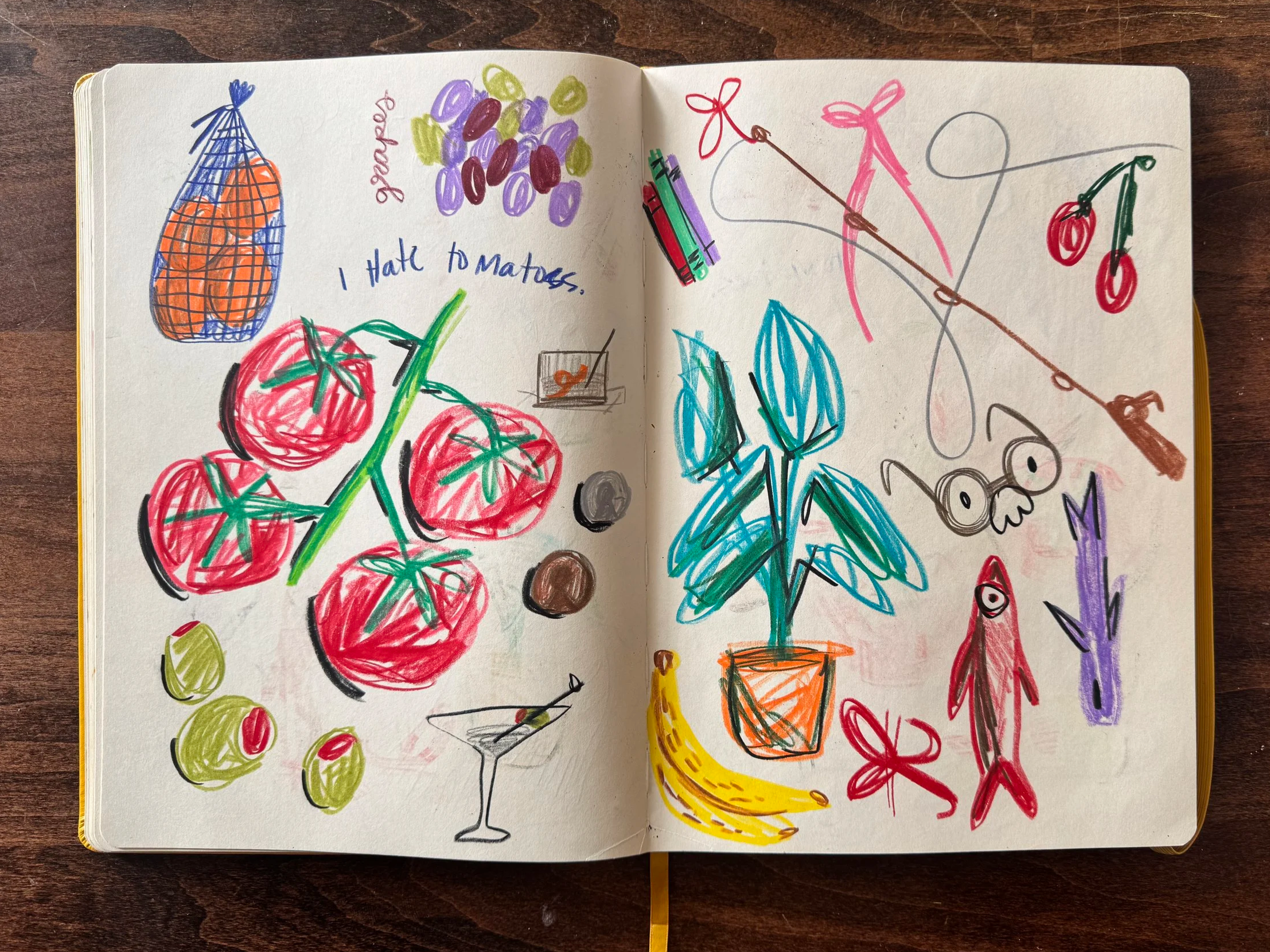Colorful drawing of tomatoes, grapes, olives, a plant in a pot, a banana, a cocktail glass, cherries, and a fishing rod with fish, along with some small doodles and the words 'I hate tomatoes' and 'goodbye'.