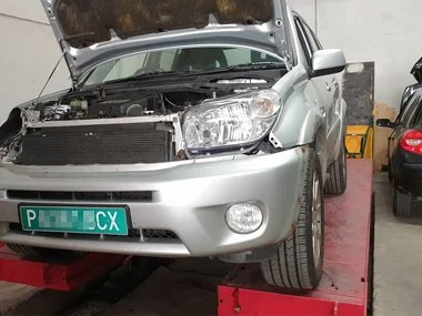Toyota Rav4 has headlights changed to continental European specification units. We'd previously arranged and fitted green, temporary import plates to this vehicle as it's UK MOT had expired. This allows the vehicle to be driven legally for up to 60 d