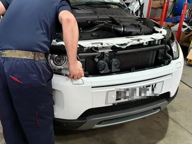 Range Rover Evoque has headlights refitted after adjustment by one of our mechanics. This left hand drive UK registered vehicle had non standard headlights orientated for driving in the UK, which could not be adjusted through the car's onboard comput