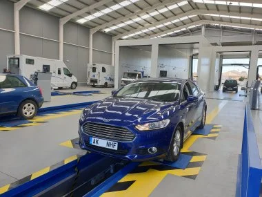 Ford Mondeo Zetec Ecotonic, currently registered in the UK is inpsected from underneath during ITV import test. All suspension parts are put through a series of stress tests as part of ITV inspection to ensure there are no issues that would prevent i