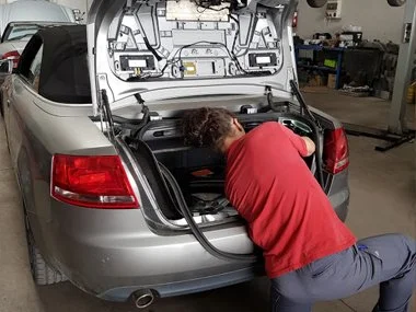 Audi A4 Cabriolet having rear light clusters re-wired prior to ITV import test in Murcia, Spain - July 2018