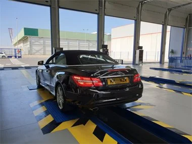 Mercedes E250 AMG Cabrio on UK plates has it's suspension checked towards the end of it's import test. The Spanish ITV import test is one of the most stringent vehicle inspections in Europe and every vehicle is thoroughly inspected from underneath as