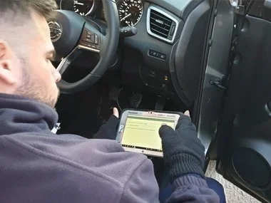 ITV import technician checks diagnostic information on his tablet during iTV import test in Murcia. From last month, new regulations meant that all Euro 5 and Euro 6 vehicles must have diagnostic data checked as part of a range of new measures introd