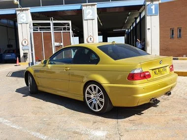 BMW M3 waits in line to be inspected as part of importation test. We realigned headlights on this vehicle as well as re-cabling rear fog light from right hand rear to left hand side. This also required a new bulb holder unit which we supplied and fit