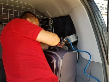 One of our vehicle technicians stamps and certifies aftermarket tinted window laminates on people carrier prior to successful ITV import test on vehicle from Malaga region - August 2018