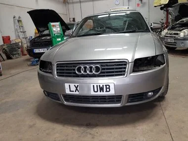 Audi A4 Cabrio with front headlights removed so that we can realign on to a flat beam pattern for European continental driving - July 2018