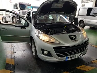 Peugeot 207 on UK registration plates is inspected during ITV import test. Our technicians spent several hours carefully cleaning up and restoring the very badly rusted, stamped chassis number on this vehicle at our workshop as there is a basic requi