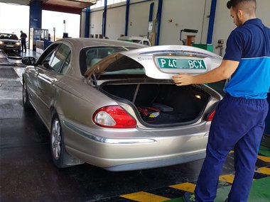 ITV technician inspects temporary import plates (also known as "placas verdes" on Jaguar X-Type at the start of ITV import test in Murcia, Spain. We fixed an engine management issue on this vehicle for our client - August 2018