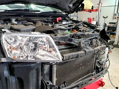 Suzuki Grand Vitara has new headlight fitted at our workshop. For this vehicle the front bumper had to be removed to facilitate removal and insertion. There was evidence of accident damage behind the headlight fitting, but fortunately the customer ne