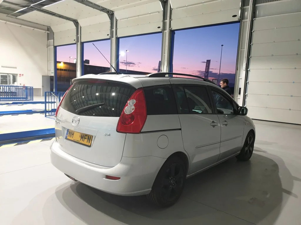 Mazda 5 on UK plates finishes it's ITV test early one evening in Murcia. We realigned headlights and rewired rear light units at our workshop on this vehicle prior to import test for our customer who will arrive back in Spain early April and collect 