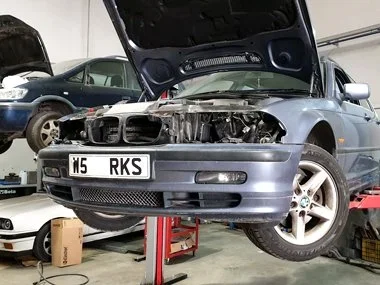 BMW 328i on UK registration plates has brand new European spec headlights fitted at our workshop. This vehicle will require a new rear suspension arm, ABS sensor cable replacement and other mechanical work before it passes it's import test and become