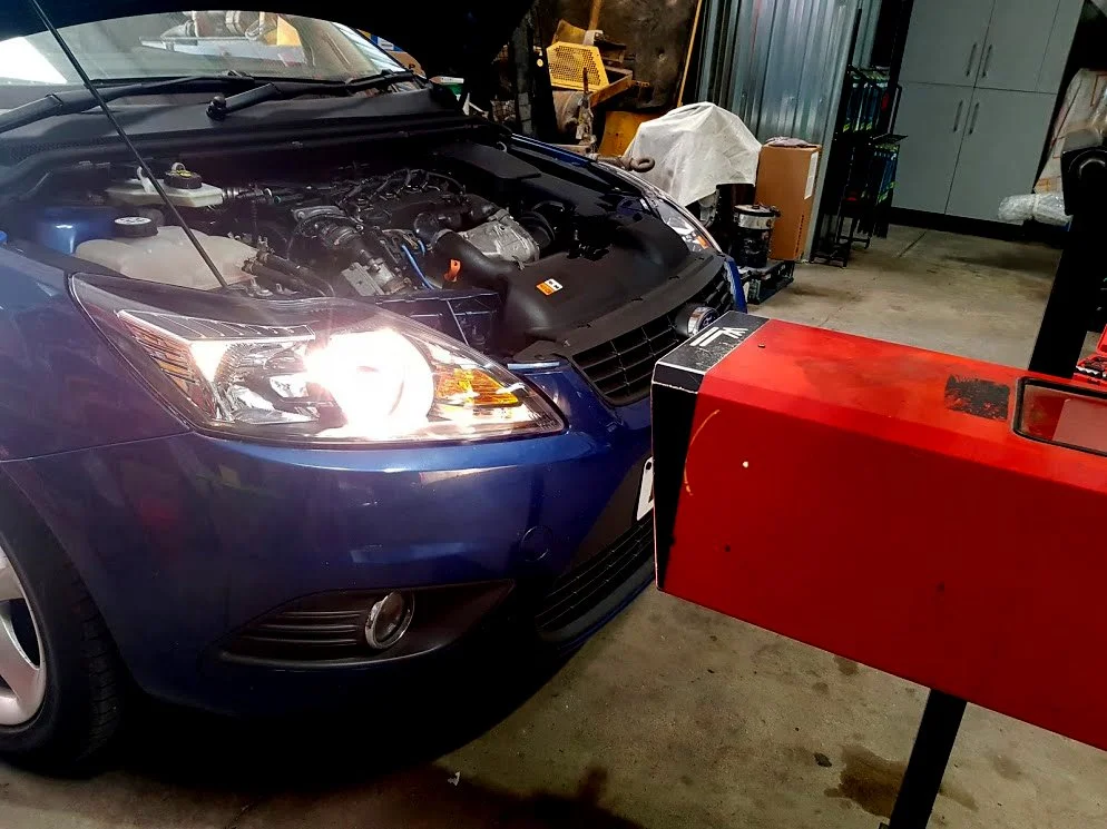 Ford Focus with new European spec. headlights installed which are being checked and aligned at our workshop prior to subsequent import test later that day. We also supplied, fitted and recabled rear fog / reverse light lenses  - August 2018