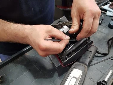 Another of our mechanics removes the seal on old rear right hand fog light unit, before fitting on to the replacement reverse light unit that we supplied to our customer at trade pricing - August 2018