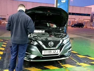 Nissan Qashqai on brand new UK registration plates is inspected by ITV technician during import test in Murcia. We had to realign the existing headlights and replace one rear LED light unit on this vehicle prior to successful import test and susbsequ