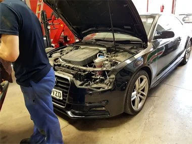 Audi A5 with headlight removed at our workshop in Murcia to allow realignment to flat beam pattern for continental European roads. The vehicle passed it's import test the same day - August 2018