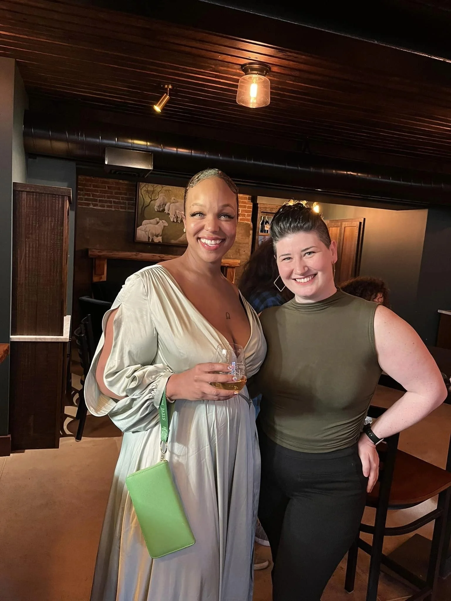 Two women smiling and posing together at a Rogue Valley Women in Business event.