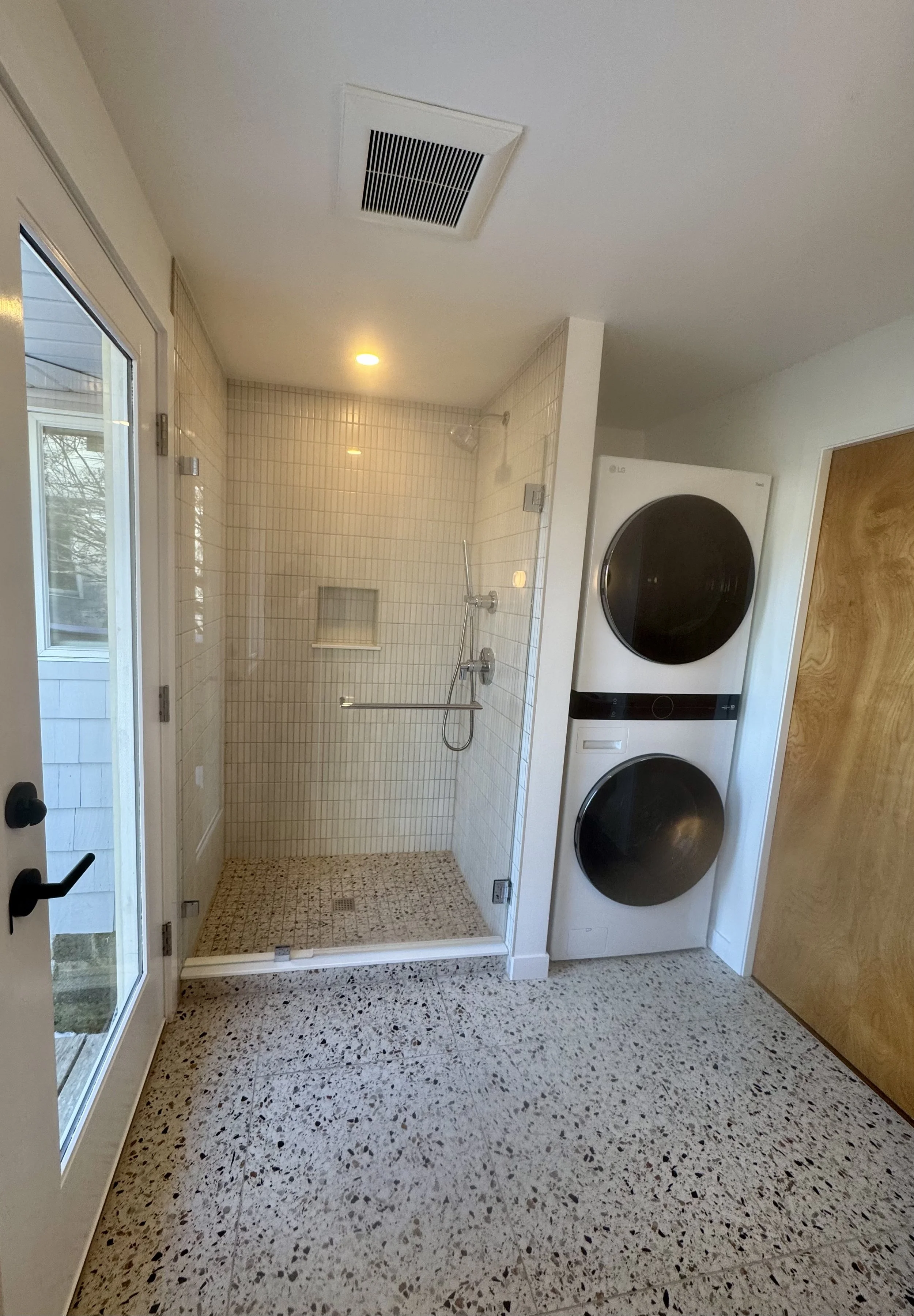 custom tile shower with niche and tile floor