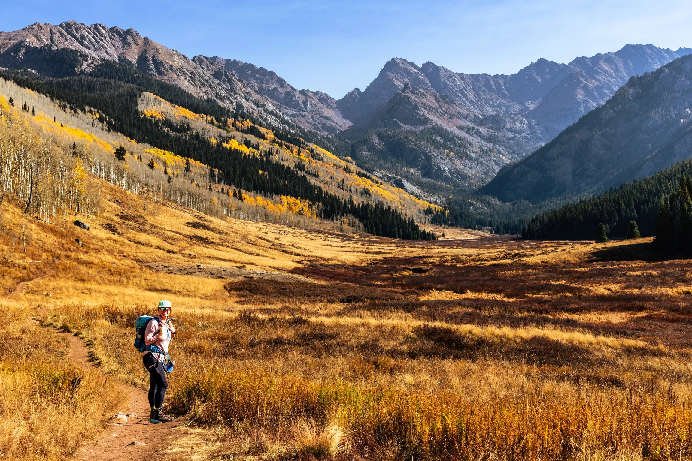 Caley Van Cleave, contemporary landscape painter, hiking in late fall near Piney River Ranch in Vail, Colorado. Photo credit to Kevin Ingham. 
