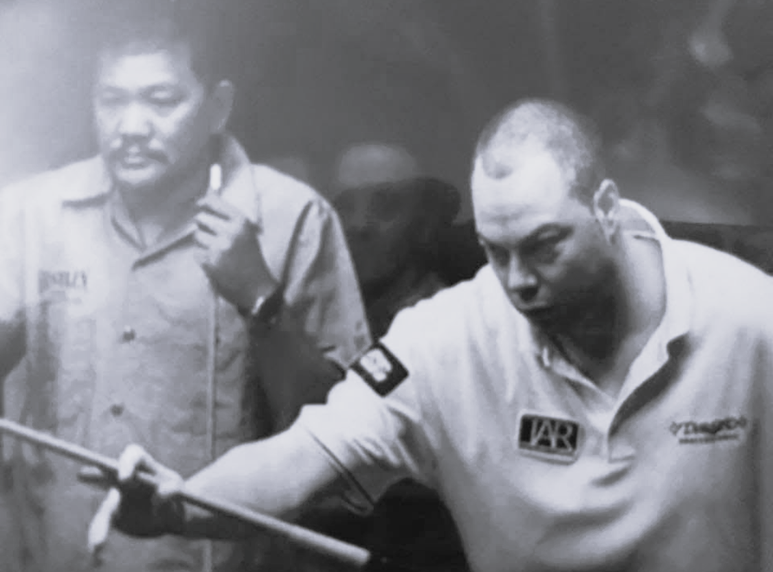 Scott Frost at the table in a high-stakes match against legendary pool champion Efren "The Magician" Reyes