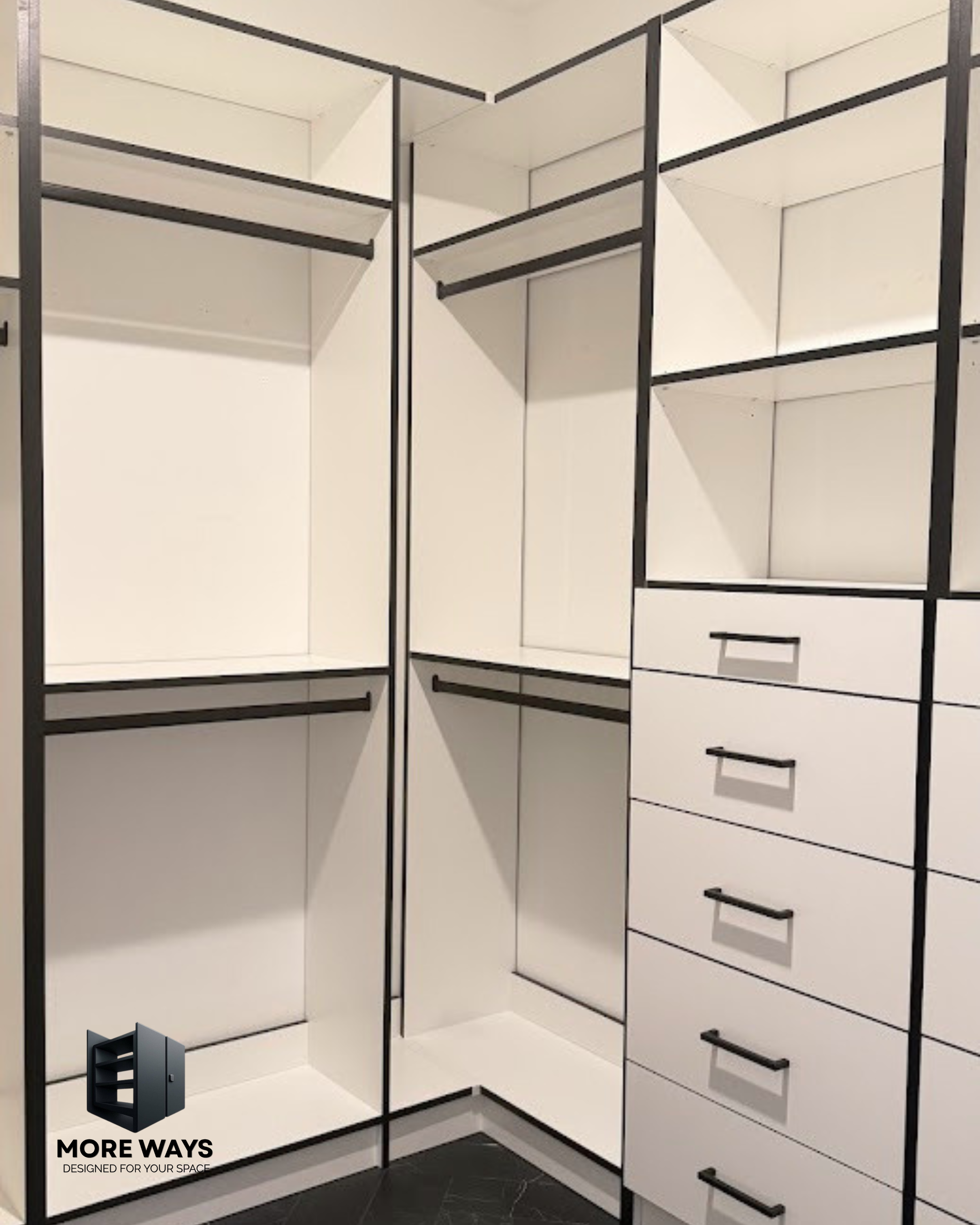 Walk-in master closet with exclusive black h-band for classic aesthetic appearance.