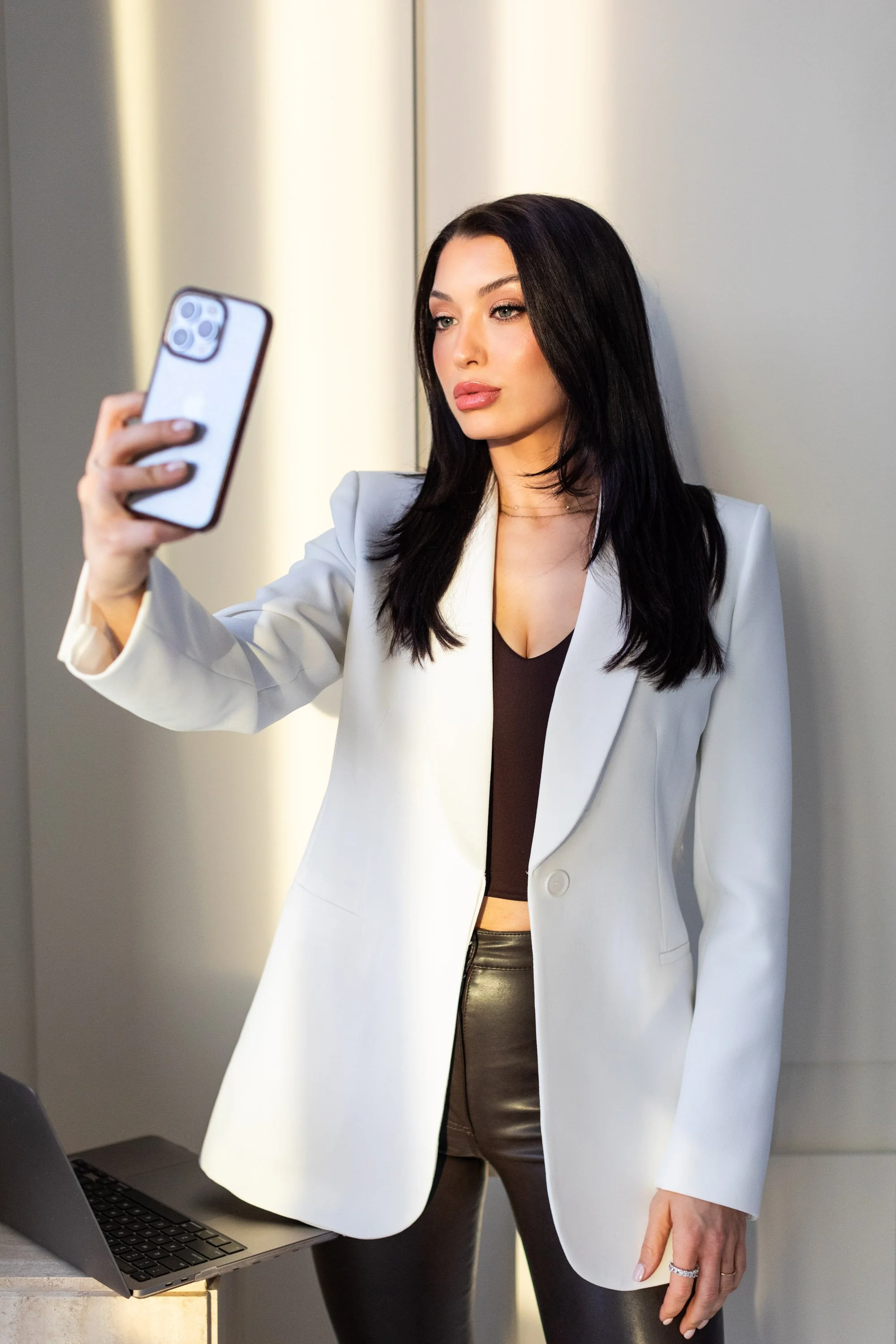 Branding photoshoot in Toronto for a makeup artist featuring model in a modern, editorial studio setting capturing personal brand visuals.