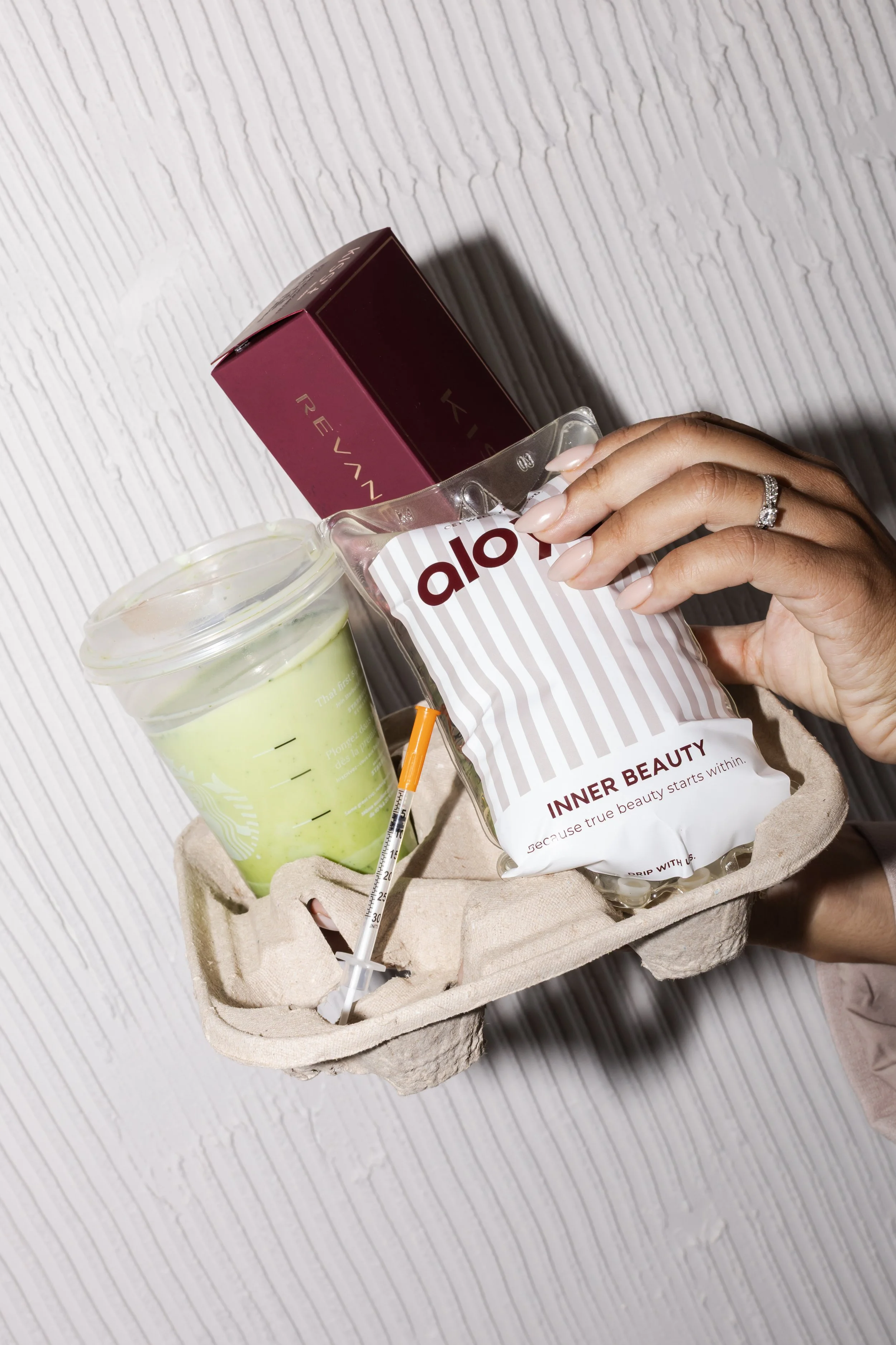 Branding product photography in Toronto for a beauty and wellness brand featuring curated products in an editorial, campaign-style setting.