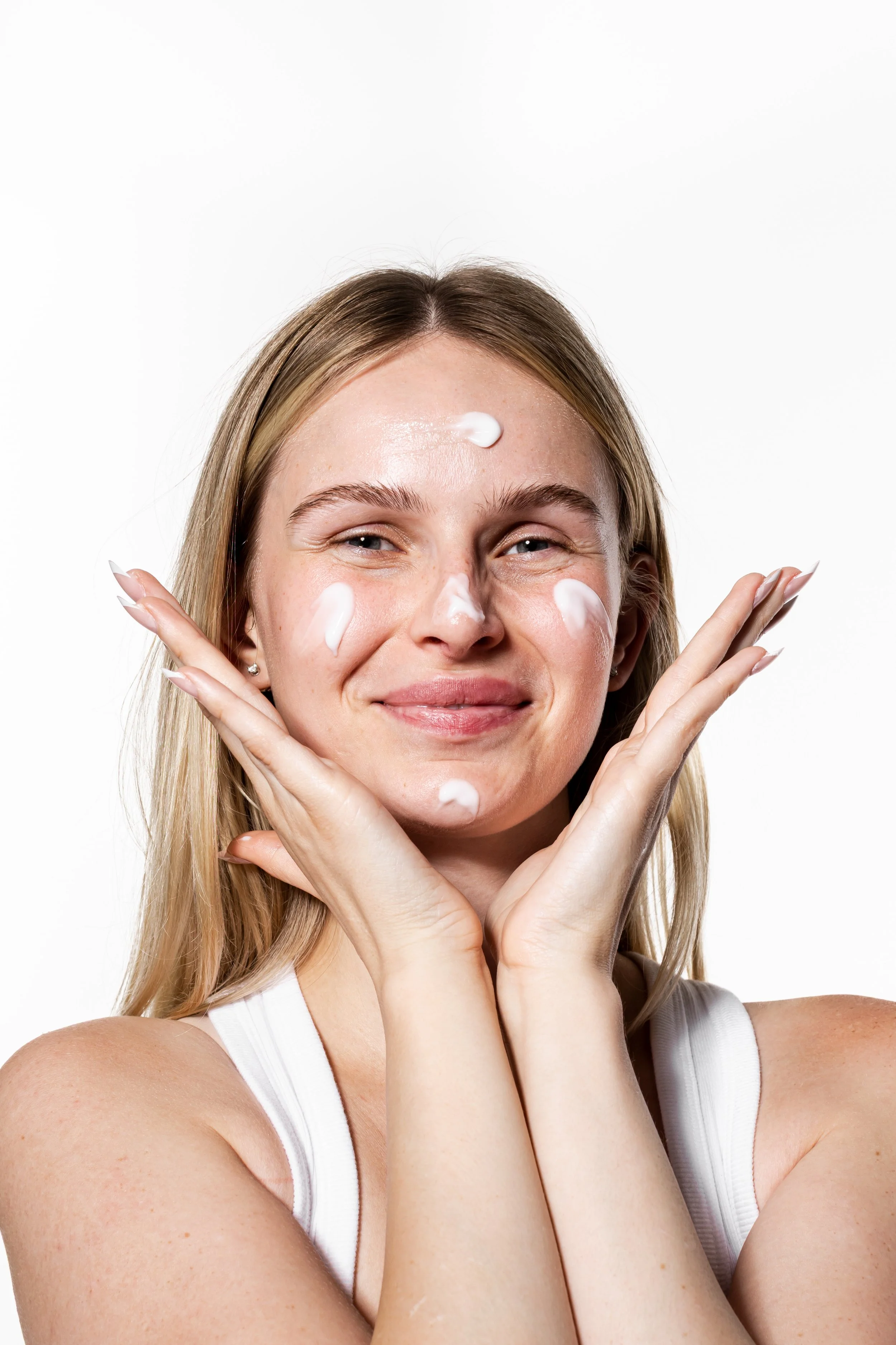 Skincare branding photoshoot in Toronto featuring beauty products styled in a clean, editorial campaign setting.