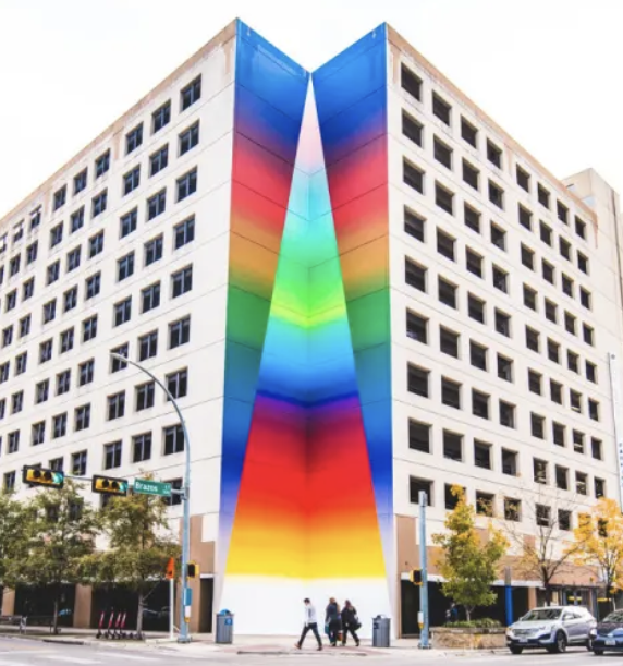 Tau Ceti rainbow graffiti mural at the intersection of 2nd street and Brazos in Austin, TX