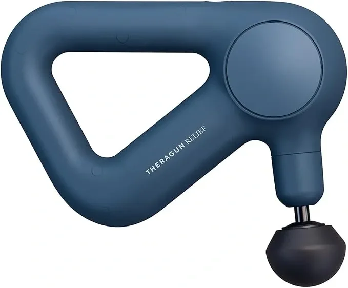 A deep blue Theragun massage device with a triangular handle and a round massage head.