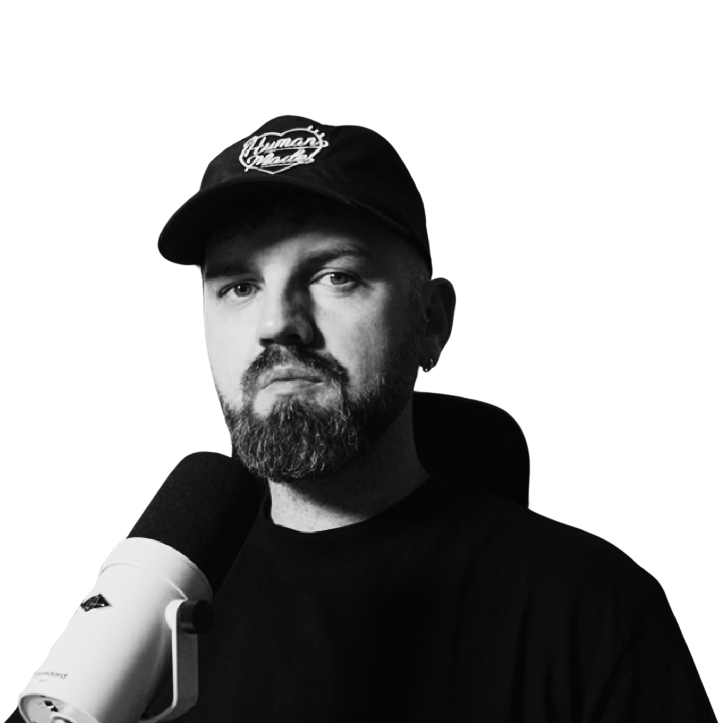 Black and white portrait of a James Mayer recording the podcast looking directly at the camera.