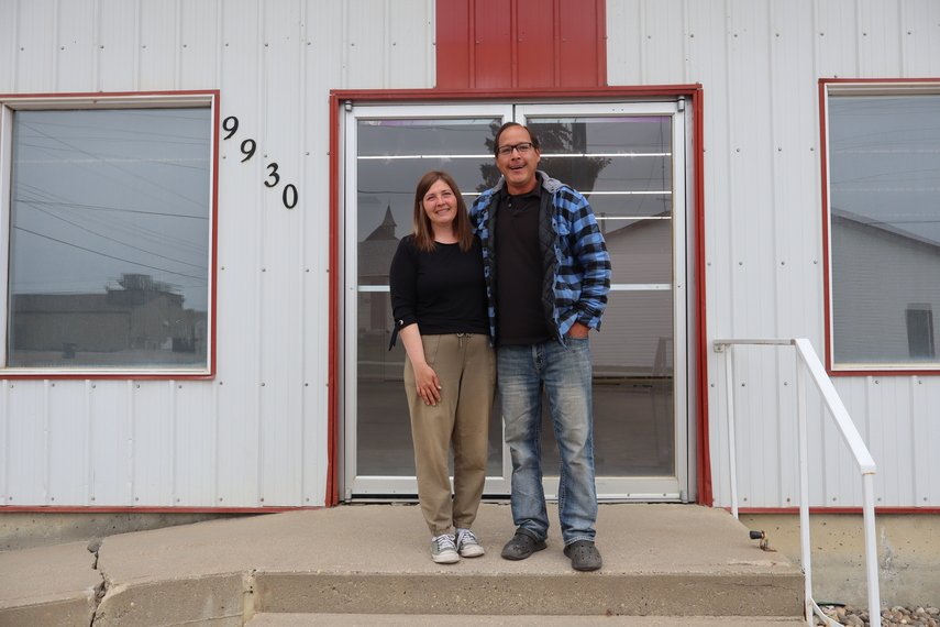 Owner's of Peace Country Hardware, Rick and Lindsay, standing in front of peace country hardware