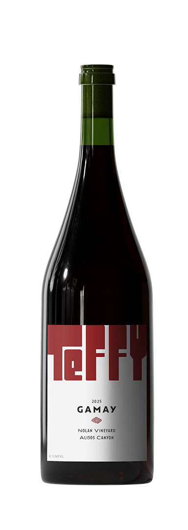 A bottle of red wine with a green foil seal, featuring a modern label design with the word "reality" partially visible in bold red and white letters, indicating it is a 2025 Gamay from Nolan Vineyard, Alisos Canyon.
