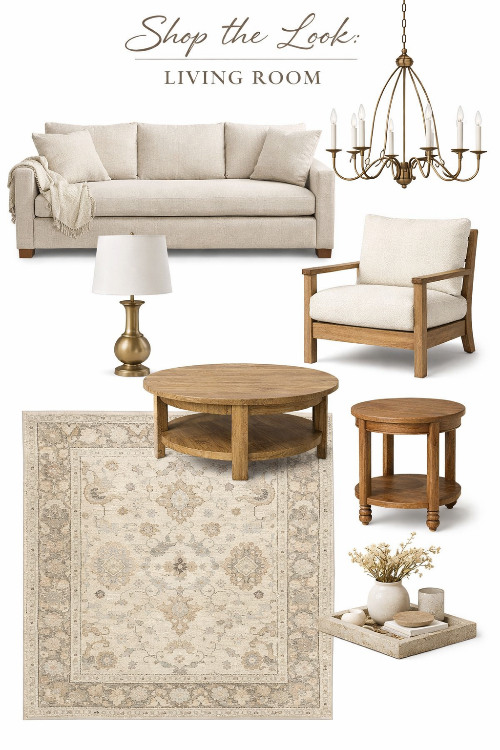 Living room furniture including a beige sofa with pillows and a throw blanket, a wooden armchair with cushions, a round wooden coffee table, a small wooden side table, a table lamp with a white shade, a chandelier, an area rug, and a decorative tray with vases and books.