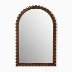 Mirror with a scalloped dark brown frame