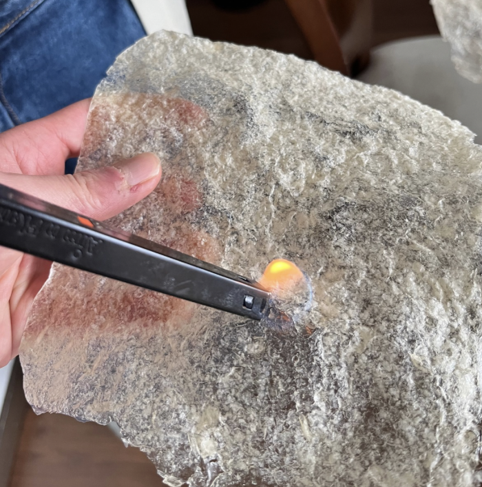 Through trial and error, we realized that the material tends to soften when exposed to direct heat. By using a lighter and applying gentle pressure, you can alter the material, and it dries almost immediately.