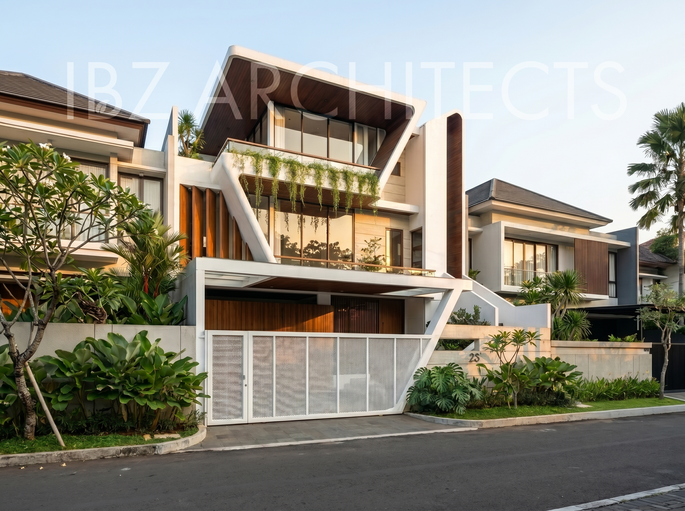 Modern multi-story house with a distinctive architectural design featuring large glass windows, white and wooden exterior, lush greenery on the balcony and surrounding areas, enclosed by a white gate with the number 23, situated along a paved street.