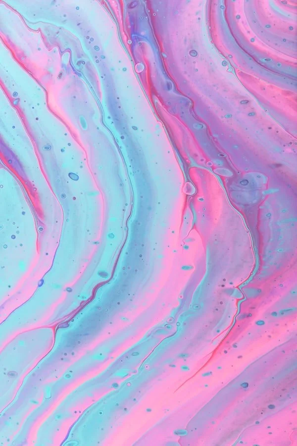 Abstract background with swirling pastel colors of pink, blue, and purple, resembling flowing paint or marbled patterns.