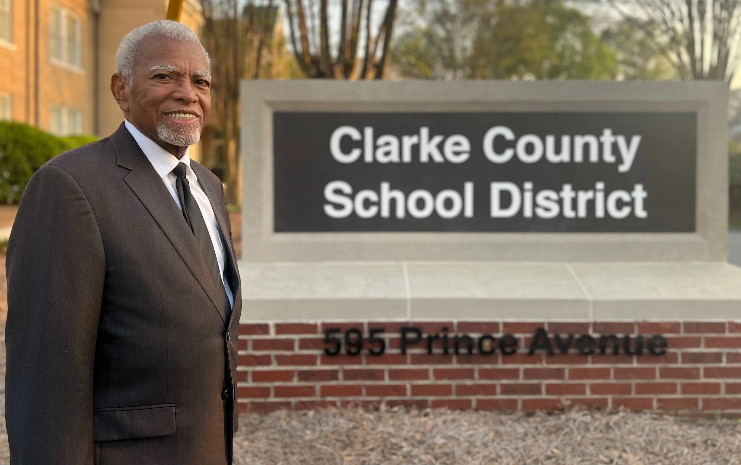 Fred Smith stands outside the Clarke County School District, reflecting his commitment to strong schools, empowered educators, and student success across the community.
