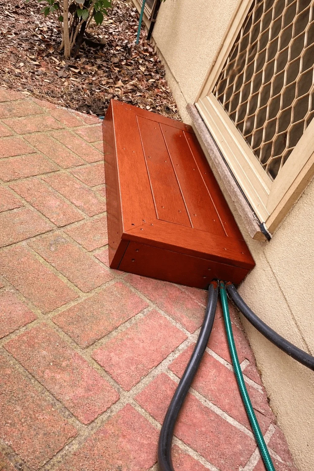 Timber door landing built for safe entry access, pipes enclosed underneath, Macleod