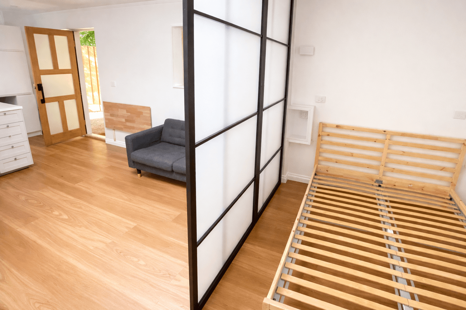 Glass room partition installed without affecting structural walls, Ivanhoe
