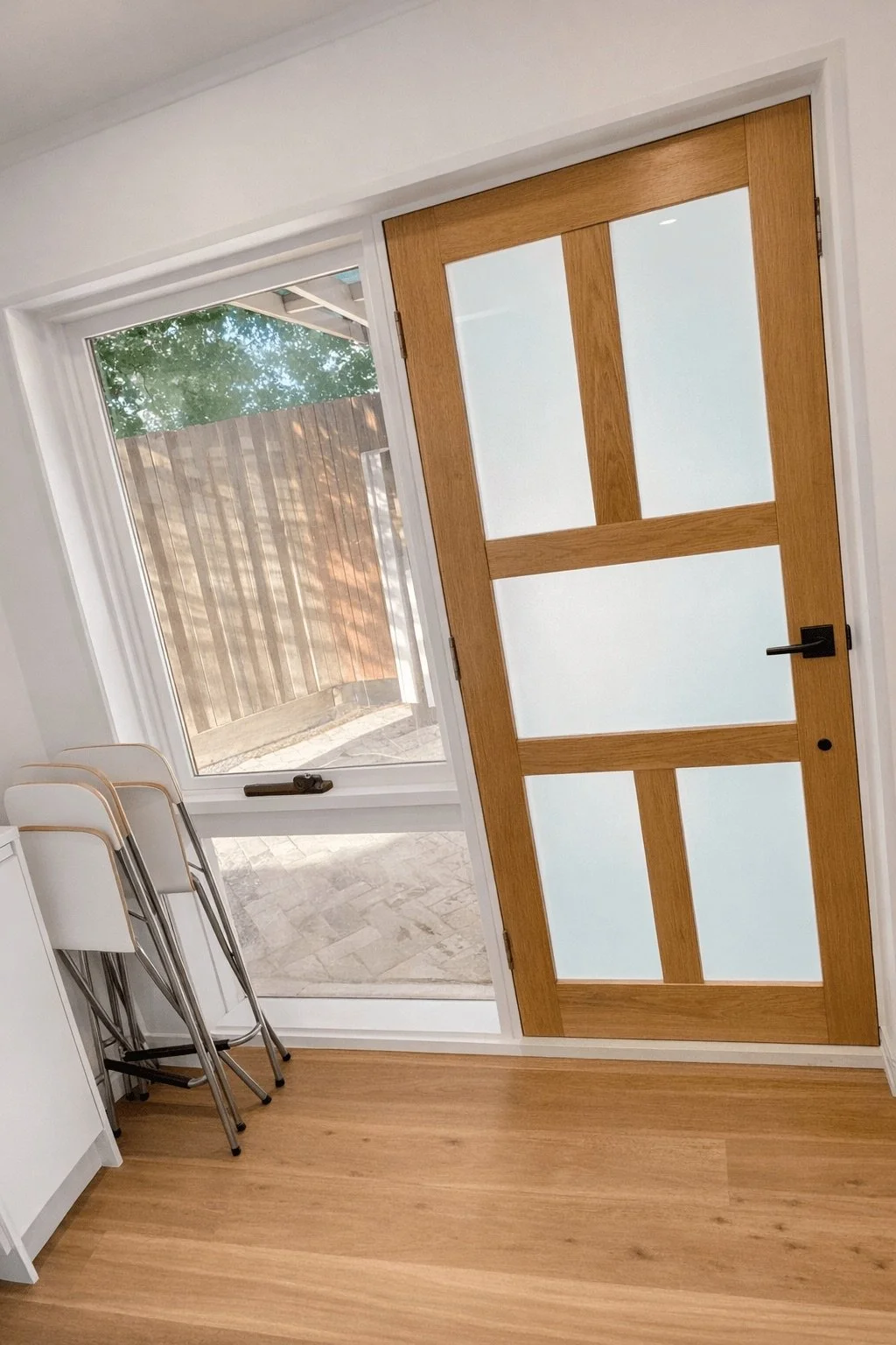 Timber and glass panel door installed with hinge adjusted for flush close, Box Hill