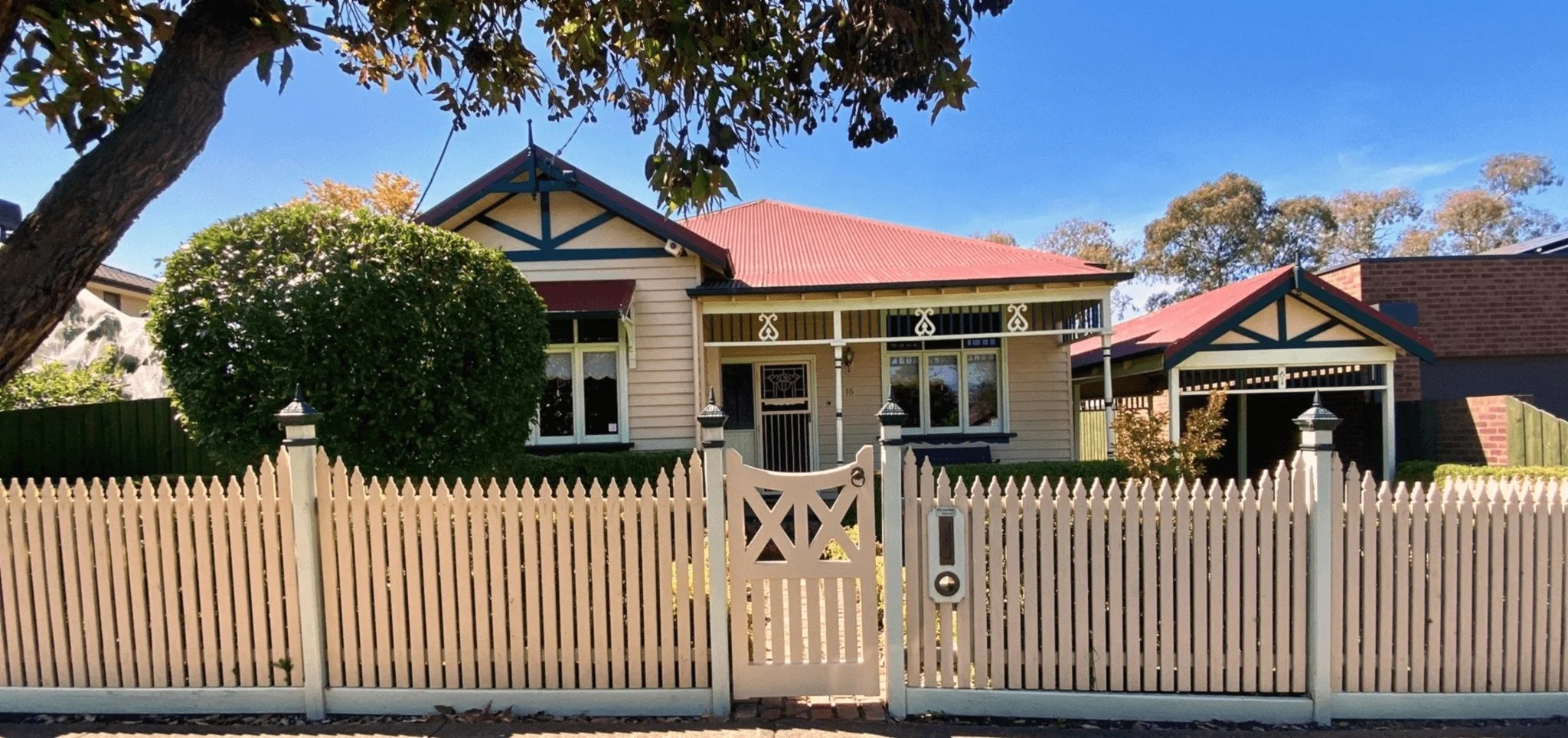 Ornate timber gate repaired and repainted with colour matched finish, Ivanhoe East