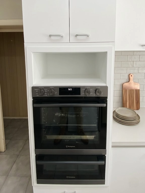 Oven trim and surrounding timber storage built after new oven installation, Bulleen
