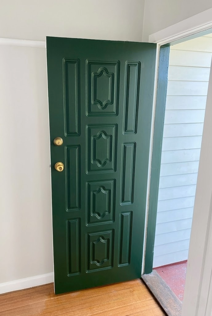 Timber panel door repainted after sun damage, Lower Plenty