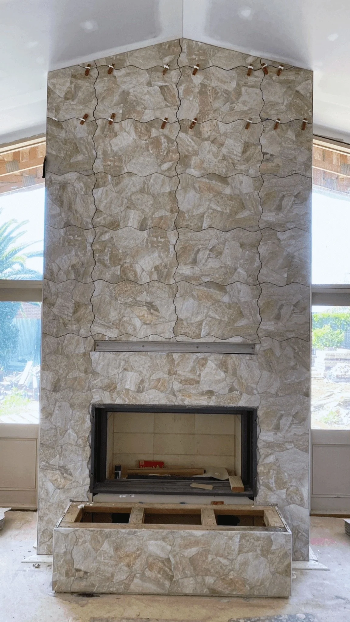 Natural stone fireplace clad with irregular shaped stones, Mont Albert