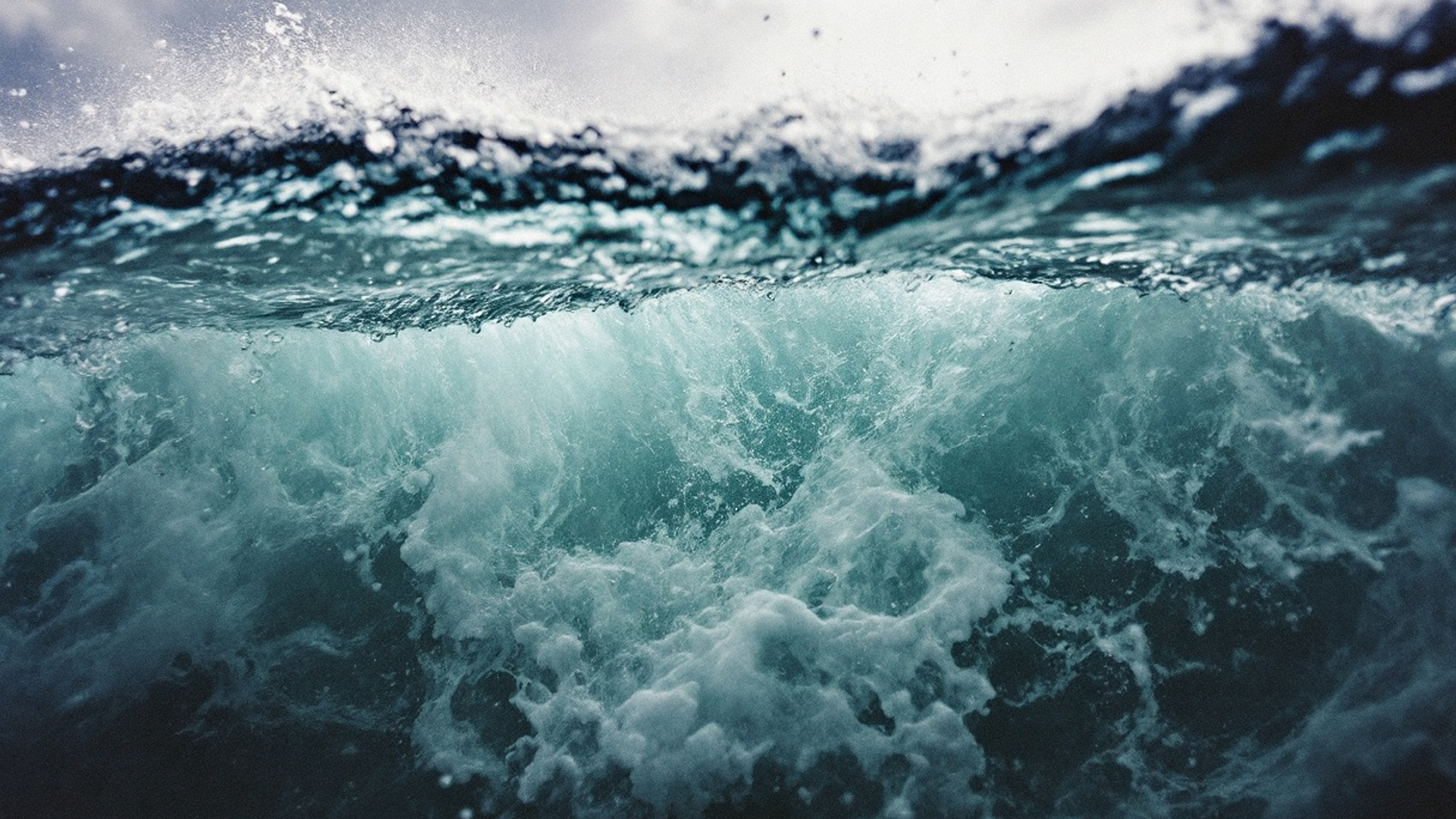 Close-up of ocean waves crashing and splashing in the water.