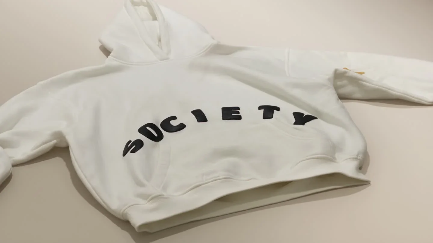 The Society hoodie in white, approved object study.