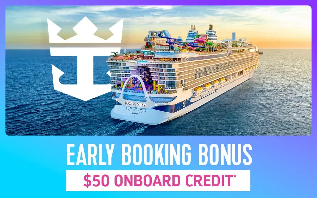 Large cruise ship with water slides and recreational facilities on deck sailing on the ocean at sunset.